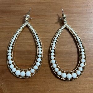 Gold hoops with faux white stone accents. Earring pair